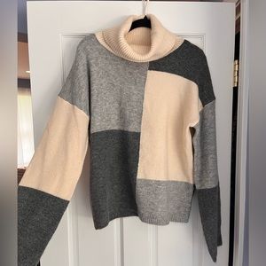 Large Hem & Thread Turtleneck Sweater